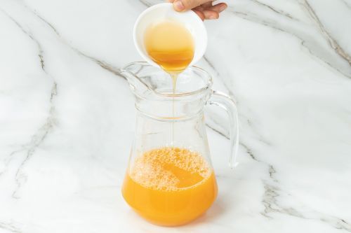 Step 1: Mix orange juice and honey in a large pitcher.