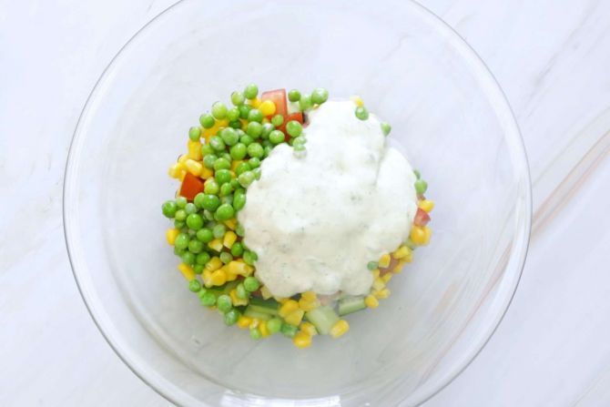 Toss the vegetables with the dressing and mix evenly