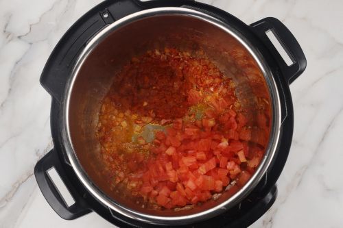 step 3: Add homemade tomato sauce and diced tomatoes.