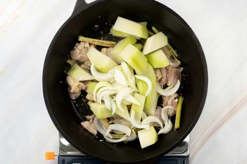 step 3: Add the chayote and onion