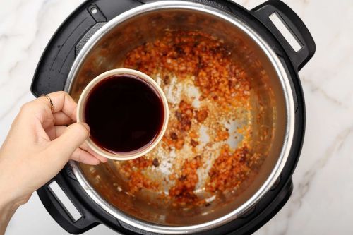 step 4: Cook the aromatics and tomato paste, then deglaze
