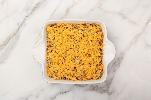 Top with cheese and bake.