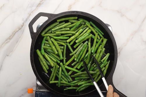 step 2: Sauté the green beans and set aside.