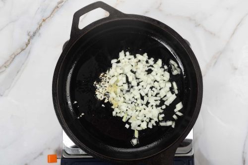 Step 2: Sauté the garlic and onions.