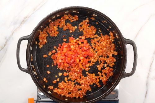 Step 4: Add the chopped tomatoes.