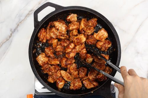 Step 6: Stir the chicken in the sauce.