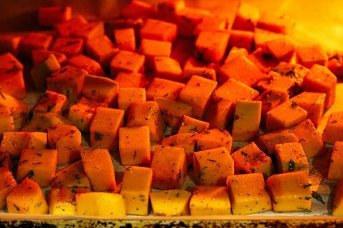 Step 2: Preheat the oven to 450°F. Line the sheet pan with parchment paper. Spread the seasoned butternut squash onto the sheet pan. Roast them for 17 minutes.